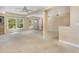 Large living area with big windows, ceiling fan, and neutral walls at 819 22Nd Nw St, Winter Haven, FL 33881