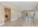 Bright and airy living room with tile flooring and access to the outdoors at 819 22Nd Nw St, Winter Haven, FL 33881
