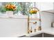 Close up view of the kitchen sink featuring a golden faucet and a view out the window at 1897 West Pkwy, Deland, FL 32724