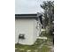 Exterior view of the home showing white siding, and a well-maintained lawn at 427 Donald St, Lakeland, FL 33813