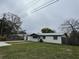 A charming single-story home with a lush green lawn and a concrete driveway at 427 Donald St, Lakeland, FL 33813