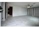 Living room with gray walls, ceiling fan and large window at 427 Donald St, Lakeland, FL 33813