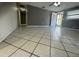 Spacious living area with tile flooring, neutral paint, and front door access at 427 Donald St, Lakeland, FL 33813