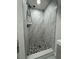 Updated shower with marble tile and modern fixtures at 427 Donald St, Lakeland, FL 33813