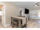 Bright dining area featuring an eat-in table, and a large TV at 6214 Elm E Sq, Lakeland, FL 33813