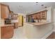 Kitchen featuring granite countertops, stainless steel appliances, and wood cabinets at 6214 Elm E Sq, Lakeland, FL 33813