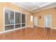 Spacious living room with large windows, recessed lighting, and well-maintained flooring at 6214 Elm E Sq, Lakeland, FL 33813