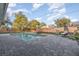 Backyard pool area with brick pavers, modern patio furniture, and a well-maintained pool at 6214 Elm E Sq, Lakeland, FL 33813