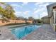 Outdoor pool showcasing the backyard, outdoor furniture, and inviting pool water at 6214 Elm E Sq, Lakeland, FL 33813