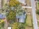 Aerial view of the property showing the yard, nearby streets, and surrounding trees at 2640 Oak Dr, Bartow, FL 33830