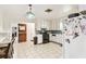 Bright kitchen featuring tile floors, white cabinets, and access to an adjacent dining area at 2640 Oak Dr, Bartow, FL 33830