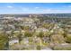 An aerial view shows the house and surrounding neighborhood at 220 Hillside Dr, Lakeland, FL 33803