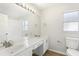 Bathroom featuring double sinks, a large mirror, and a separate shower at 2726 Herons Landing Dr, Kissimmee, FL 34741