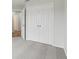 Bedroom featuring neutral carpet, a closet with double doors, and open doorway at 2726 Herons Landing Dr, Kissimmee, FL 34741