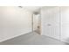 This bedroom has neutral walls, gray carpet and a large closet with double doors at 2726 Herons Landing Dr, Kissimmee, FL 34741