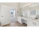 Well-lit main bathroom with double vanity, large mirror, and separate shower and tub at 2726 Herons Landing Dr, Kissimmee, FL 34741
