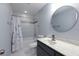 Bathroom features a shower over tub combination, granite countertop, and modern vanity mirror at 290 Ne 51St Ave, Ocala, FL 34470