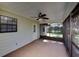 Enclosed screened-in porch offers a relaxing space with ceiling fan and access to the backyard at 290 Ne 51St Ave, Ocala, FL 34470