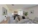 Bright bedroom boasts a sitting area with couch and chair, and view of the exterior at 4759 Golden Knight Blvd, Kissimmee, FL 34746