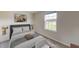 Inviting bedroom with a comfortable bed, natural light, and modern décor at 4759 Golden Knight Blvd, Kissimmee, FL 34746