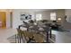 Open-concept living and dining area featuring modern decor and ample natural light at 4759 Golden Knight Blvd, Kissimmee, FL 34746