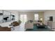 Cozy living room with a comfortable seating area, modern furnishings, and natural light at 4759 Golden Knight Blvd, Kissimmee, FL 34746