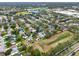 An aerial view shows a mature neighborhood and tree lined streets at 390 Lisa Karen Cir, Apopka, FL 32712