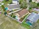 Aerial view of a private backyard featuring a pool, green lawn, and white fencing at 390 Lisa Karen Cir, Apopka, FL 32712