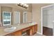 Bathroom featuring double sinks, a vanity area, and large mirror at 390 Lisa Karen Cir, Apopka, FL 32712