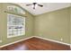 Cozy bedroom with a ceiling fan and window with natural light at 390 Lisa Karen Cir, Apopka, FL 32712