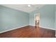 Bedroom featuring hardwood flooring and a neutral wall color at 390 Lisa Karen Cir, Apopka, FL 32712