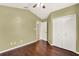 Bedroom featuring hardwood floors and closet at 390 Lisa Karen Cir, Apopka, FL 32712