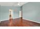 Light and airy bedroom featuring hardwood flooring and ensuite bathroom at 390 Lisa Karen Cir, Apopka, FL 32712