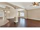 Inviting living room featuring hardwood floors, neutral wall paint, and decorative columns at 390 Lisa Karen Cir, Apopka, FL 32712