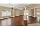 Bright living room featuring hardwood flooring, large windows, and open space at 390 Lisa Karen Cir, Apopka, FL 32712