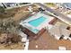 Aerial view of the pool area, sun-shades, lounge chairs, picnic area, and community building at 5789 Timber Meadow Way, St Cloud, FL 34771