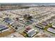 An aerial view of the community showcasing the neighborhood, pool and a scenic pond at 5789 Timber Meadow Way, St Cloud, FL 34771