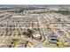 An aerial view of the community showcasing the neighborhood, pool, playground, and a scenic pond at 5789 Timber Meadow Way, St Cloud, FL 34771