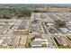 An aerial view of the community showcasing the neighborhood, pool and a scenic pond at 5789 Timber Meadow Way, St Cloud, FL 34771