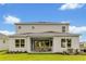 Backyard featuring outdoor dining, a well-manicured lawn, and a patio for entertaining at 5789 Timber Meadow Way, St Cloud, FL 34771