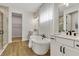 Modern bathroom featuring a soaking tub, double vanity and glass shower at 5789 Timber Meadow Way, St Cloud, FL 34771