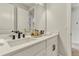 Modern bathroom features a double sink vanity with quartz countertops and matte black hardware at 5789 Timber Meadow Way, St Cloud, FL 34771