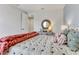 Well-decorated bedroom with an accent wall, a thick knit throw, and decorative pillows on the bed at 5789 Timber Meadow Way, St Cloud, FL 34771