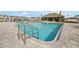 Community pool featuring clear, refreshing water and chrome ladder at 5789 Timber Meadow Way, St Cloud, FL 34771