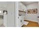 Well-lit laundry room with cabinetry, sink, and modern design at 5789 Timber Meadow Way, St Cloud, FL 34771