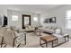 Bright living room showcasing stylish seating, a wood coffee table, and neutral decor at 5789 Timber Meadow Way, St Cloud, FL 34771