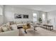 Inviting living room featuring comfortable seating, a wood coffee table, and natural light at 5789 Timber Meadow Way, St Cloud, FL 34771