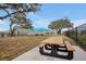 Outdoor picnic area with tables, seating, and a sun-shade perfect for community gatherings at 5789 Timber Meadow Way, St Cloud, FL 34771