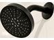 Close-up of a modern Moen matte black shower head with multiple spray settings at 5789 Timber Meadow Way, St Cloud, FL 34771