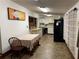 Eat-in kitchen with white cabinets and black appliances at 24645 Ne 177Th Ter, Fort Mc Coy, FL 32134